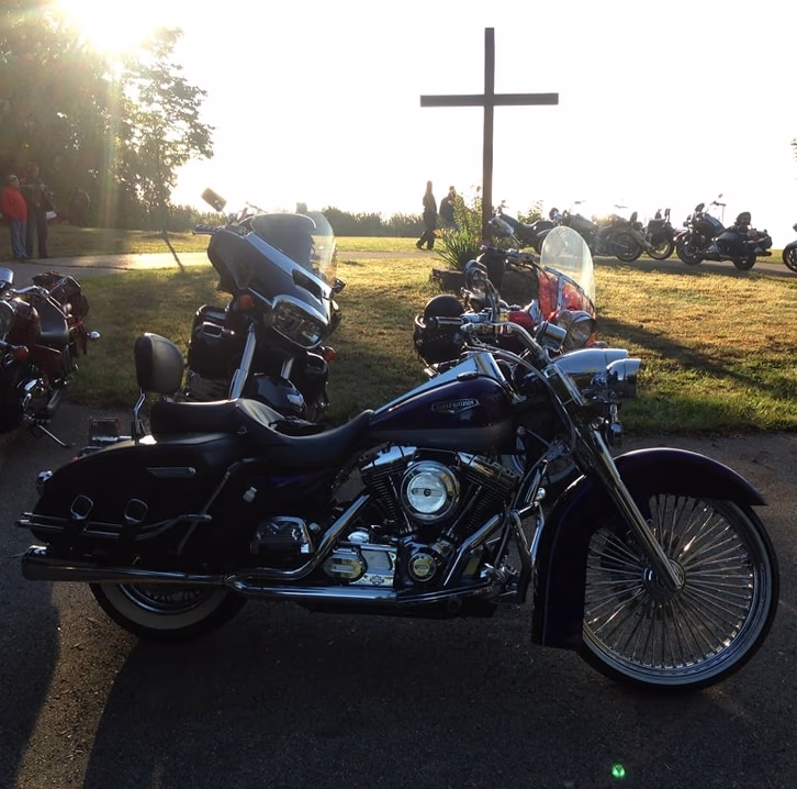 Motorcycle in front of cross
